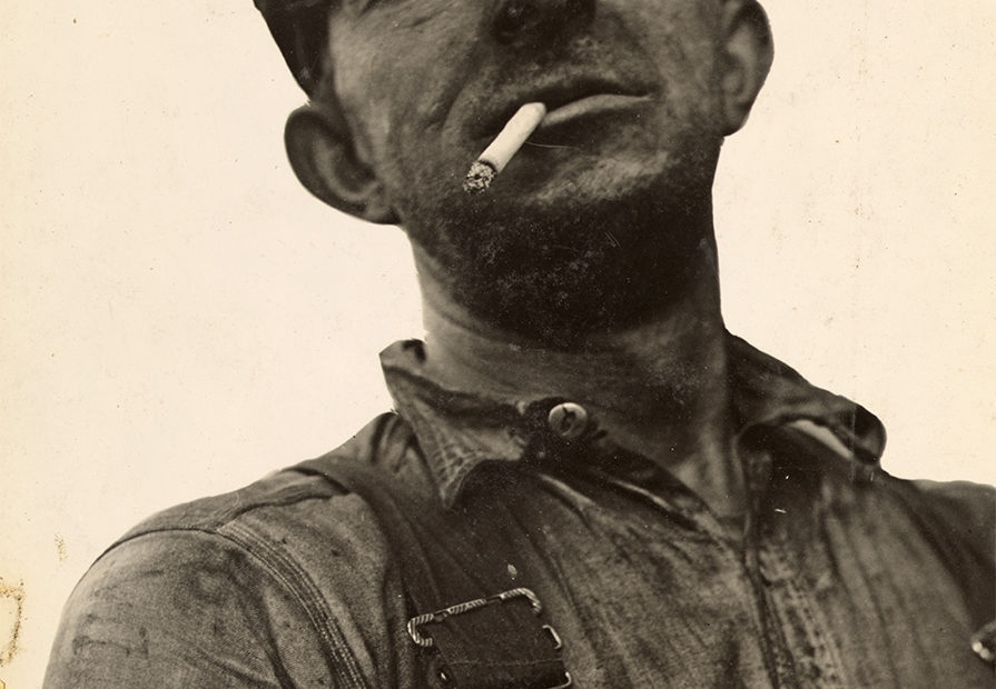 A bootleg miner smoking a cigarette