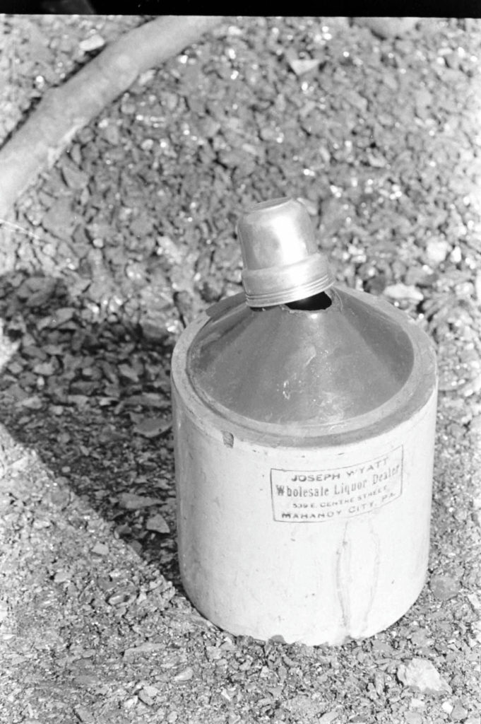 Liquor jug at a bootleg mine, 1937. Joseph Wyatt, Wholesale Liquor Dealer, 539 E Center St, Mahanoy City, PA.
